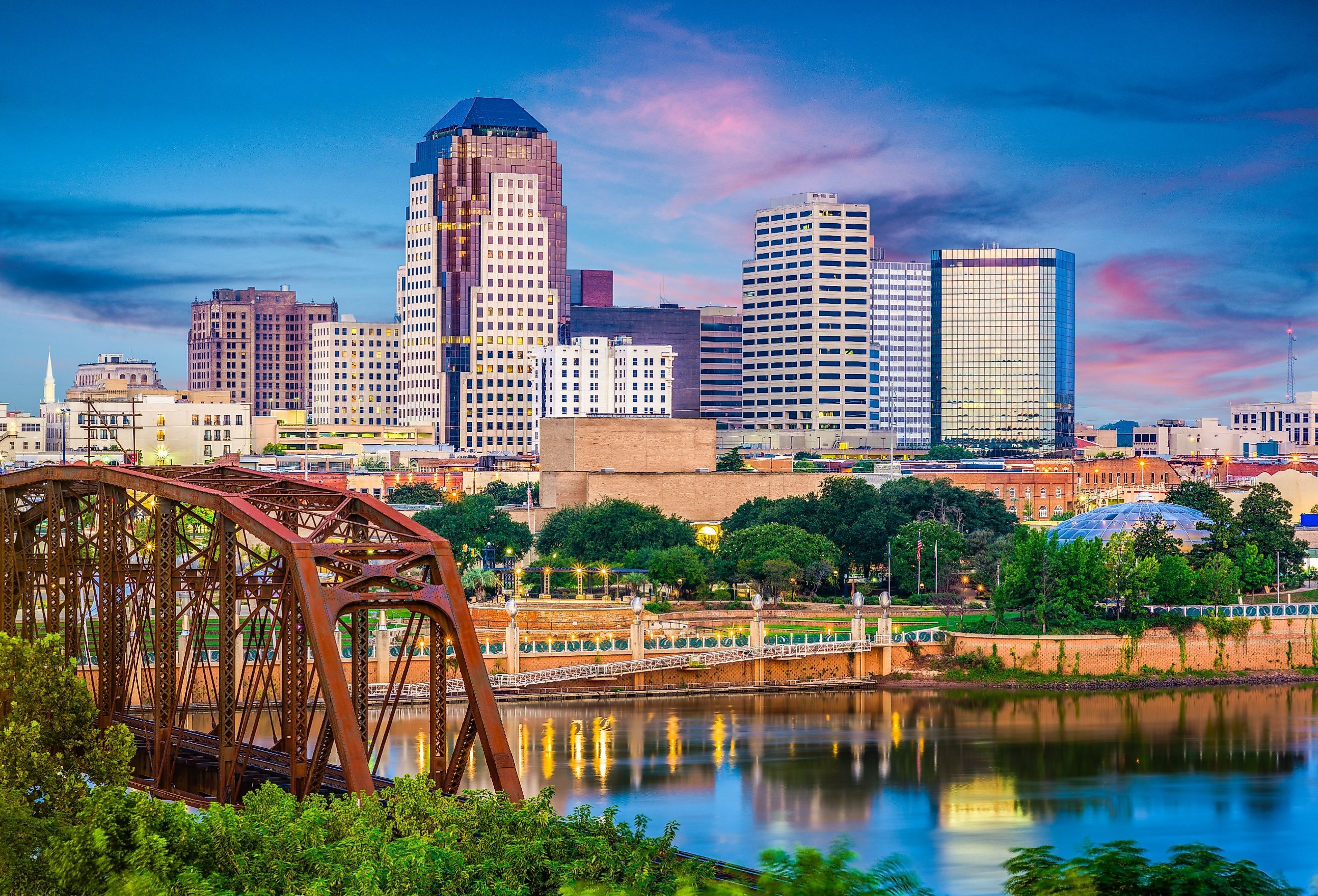 Shreveport, Louisiana, skyline over the Red River at dusk.