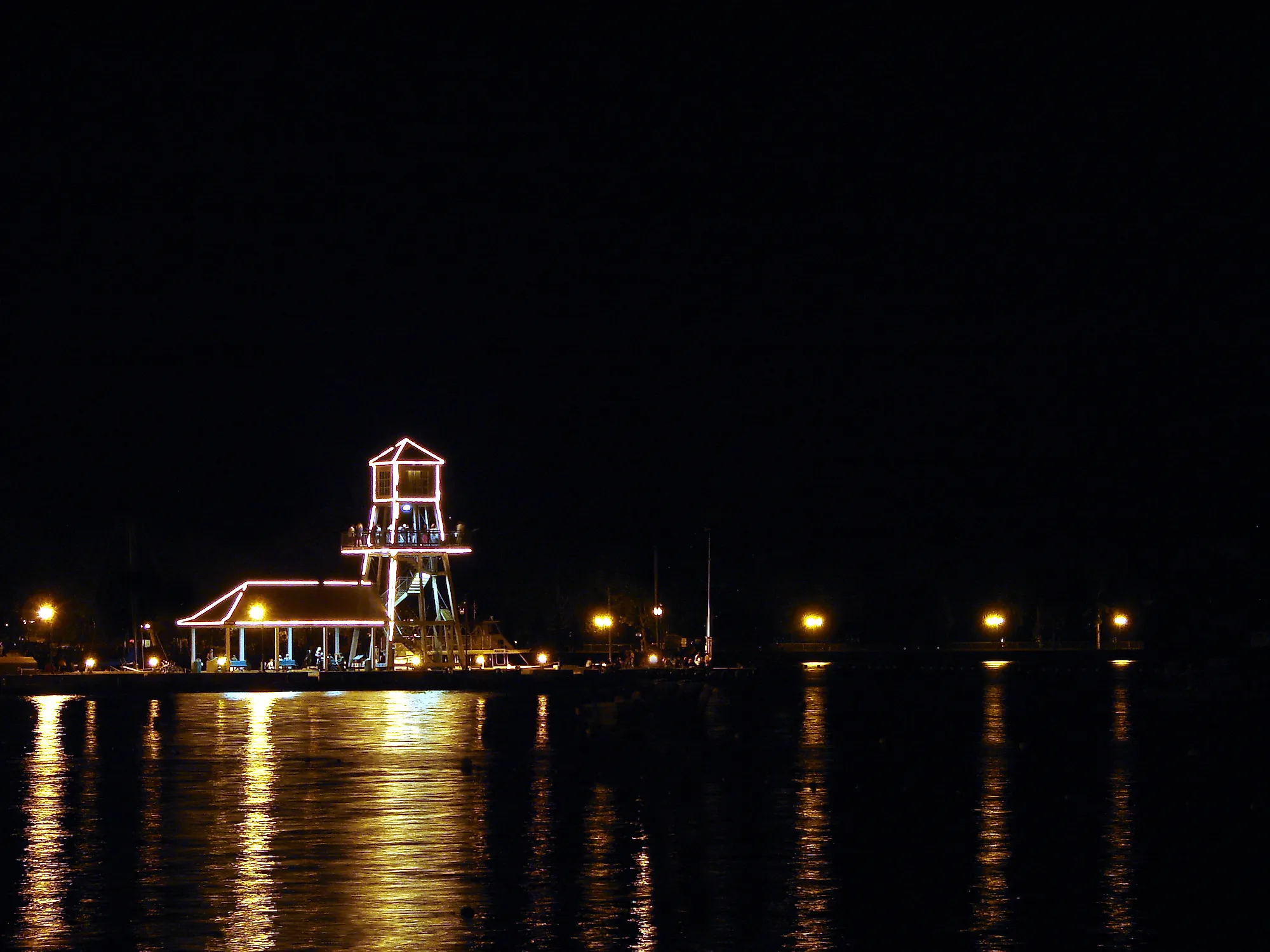 Observatory tower at night on Memphremagog Lake in Magog, Quebec. Shutterstock.com