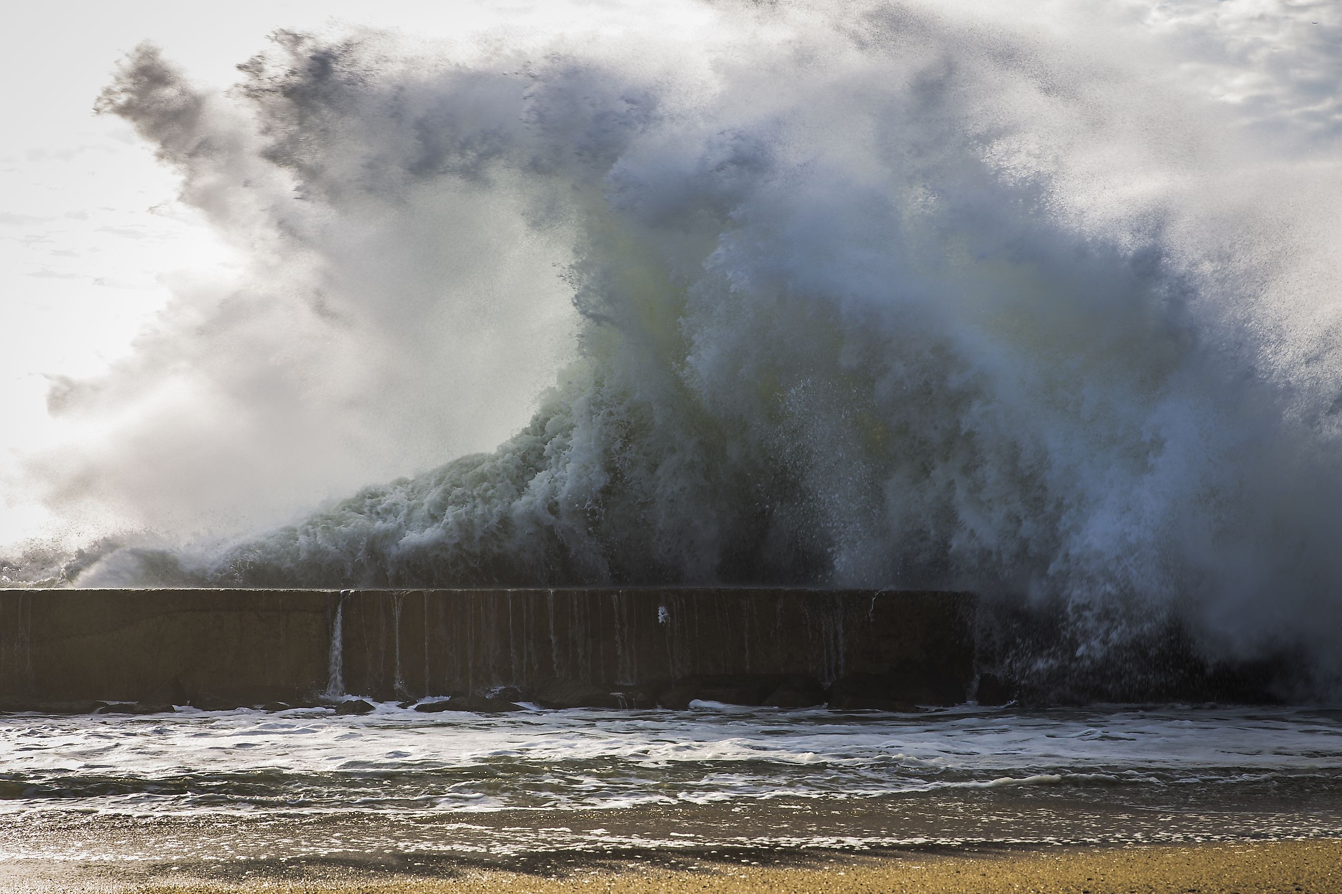 Huge wave by the ocean. 
