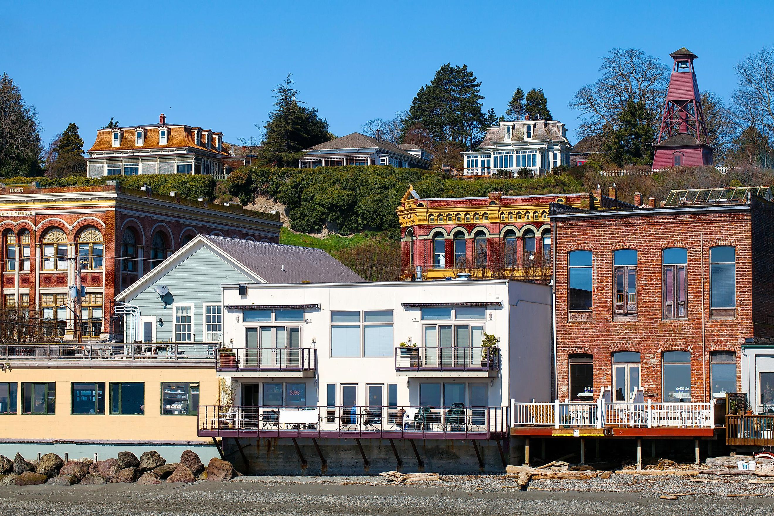 Port Townsend, Washington waterfront view of old Victorian era architecture on a clear sunny day with blue sky.