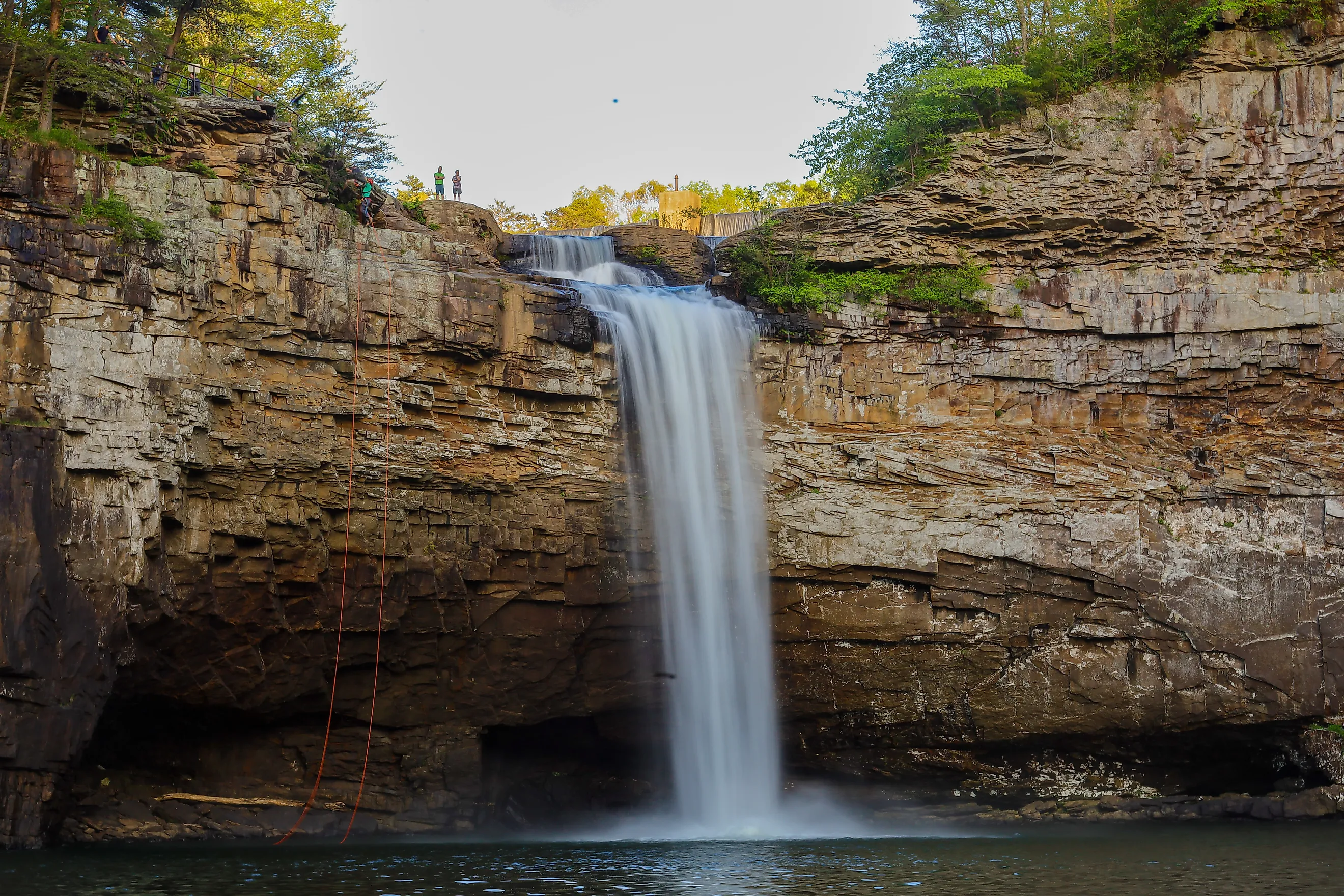 Hikers rappelling down DeSoto Falls in Northeast Alabama.