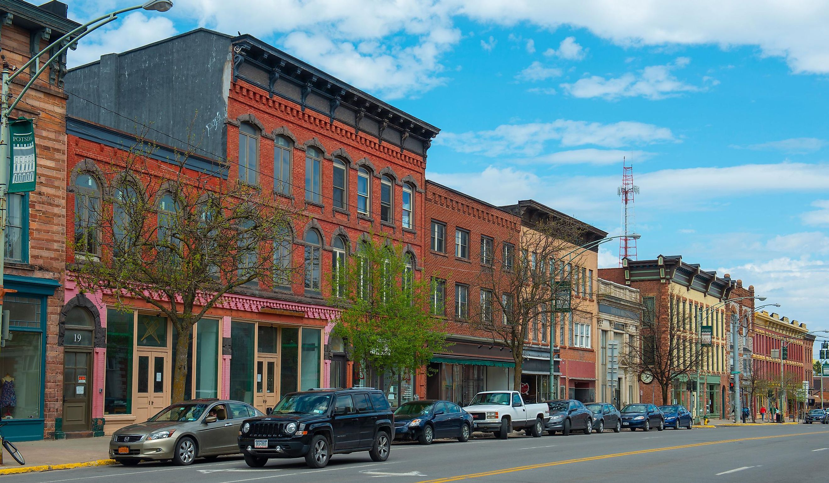 Historic sandstone and brick commercial buildings with Italianate style on Market Street at Main Street in downtown Potsdam, Upstate New York NY, USA. Editorial credit: Wangkun Jia / Shutterstock.com