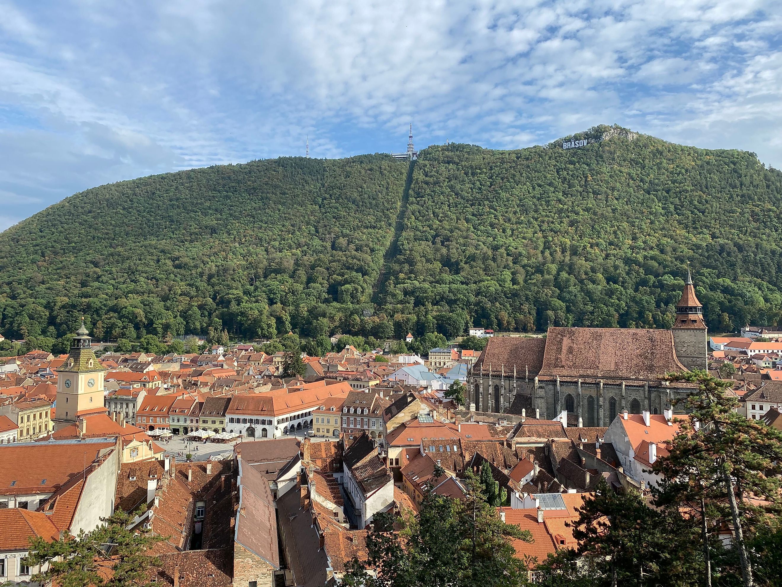 The Black Church, opposing mountain, and rest of Brasov’s red-roofed Old Town as seen from atop the historic White Tower. Photo credit: Andrew Douglas