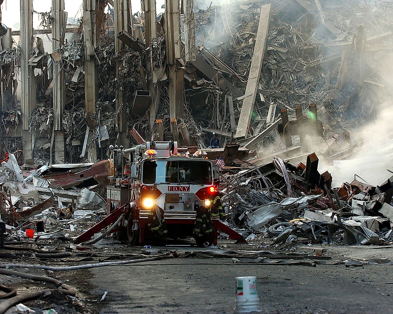 A lone fire engine at the crime scene in Manhattan where the World Trade Center collapsed following the Sept. 11 terrorist attack. Image credit: Chief Photographer's Mate Eric J. TIlford./Public domain