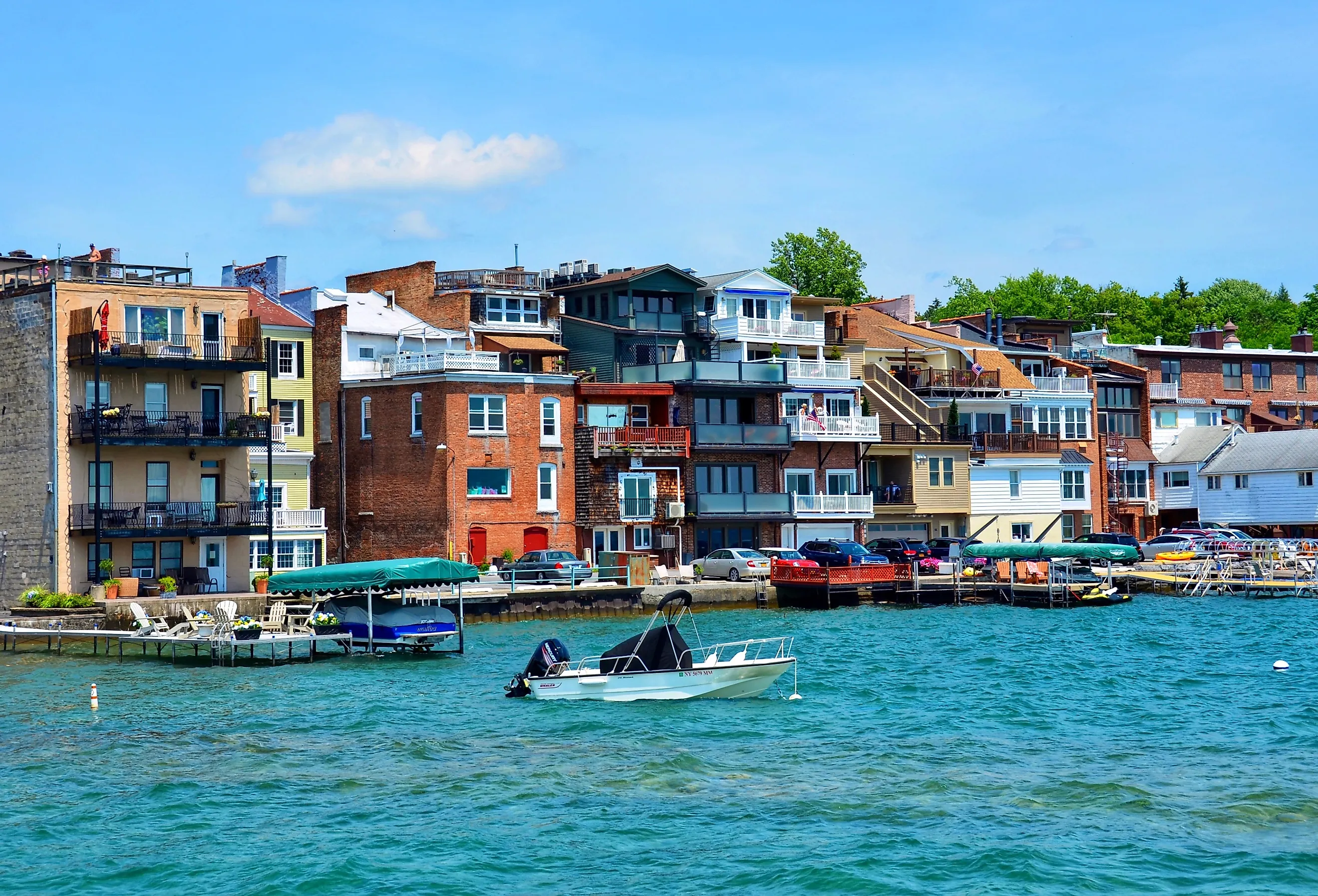 Shops and restaurants on Skaneateles Lake in upstate New York, view from the pier. Image credit PQK via Shutterstock.com