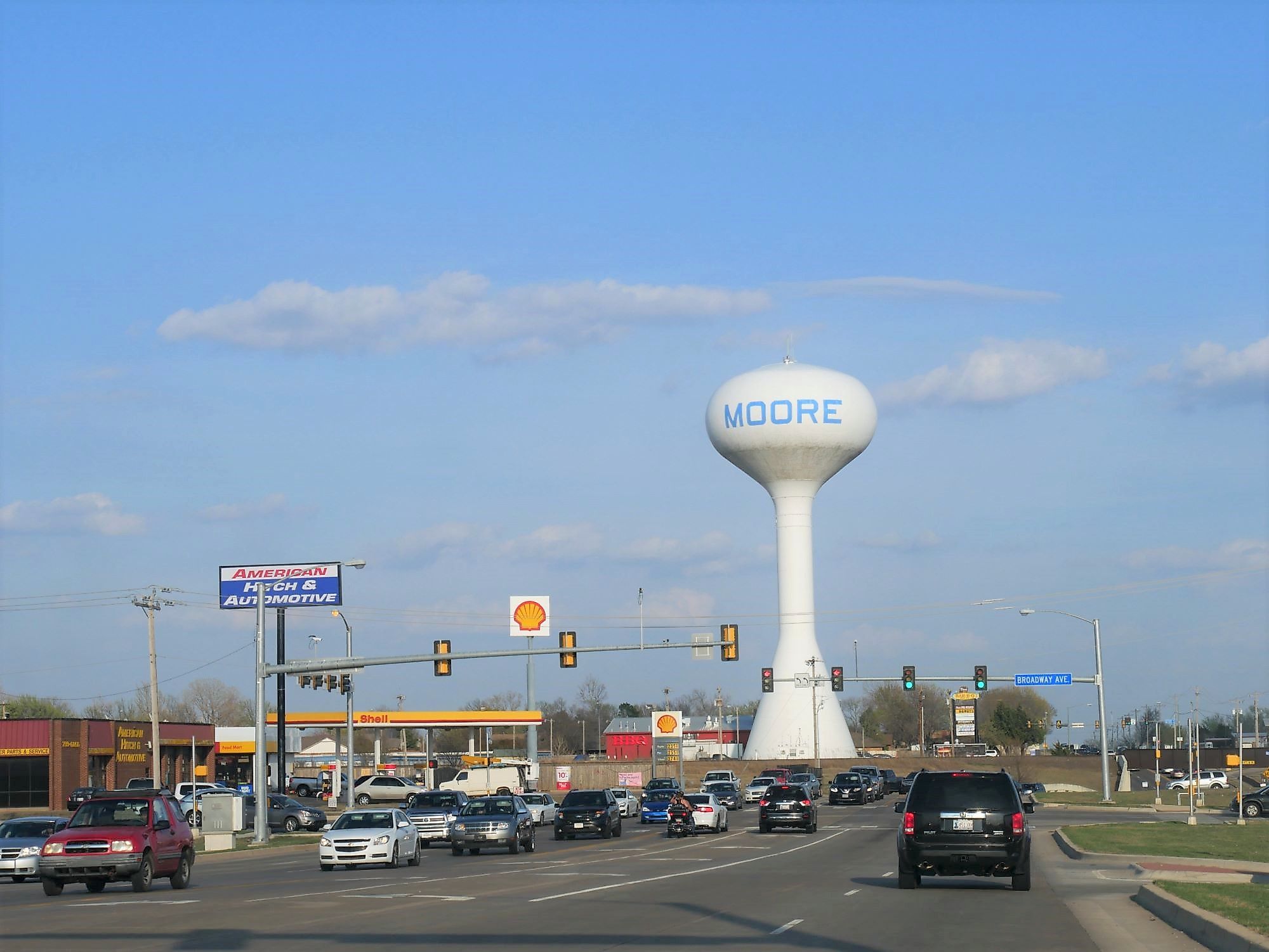 Late afternoon traffic with the giant water tank in Moore, Oklahoma. Editorial credit: RaksyBH / Shutterstock.com