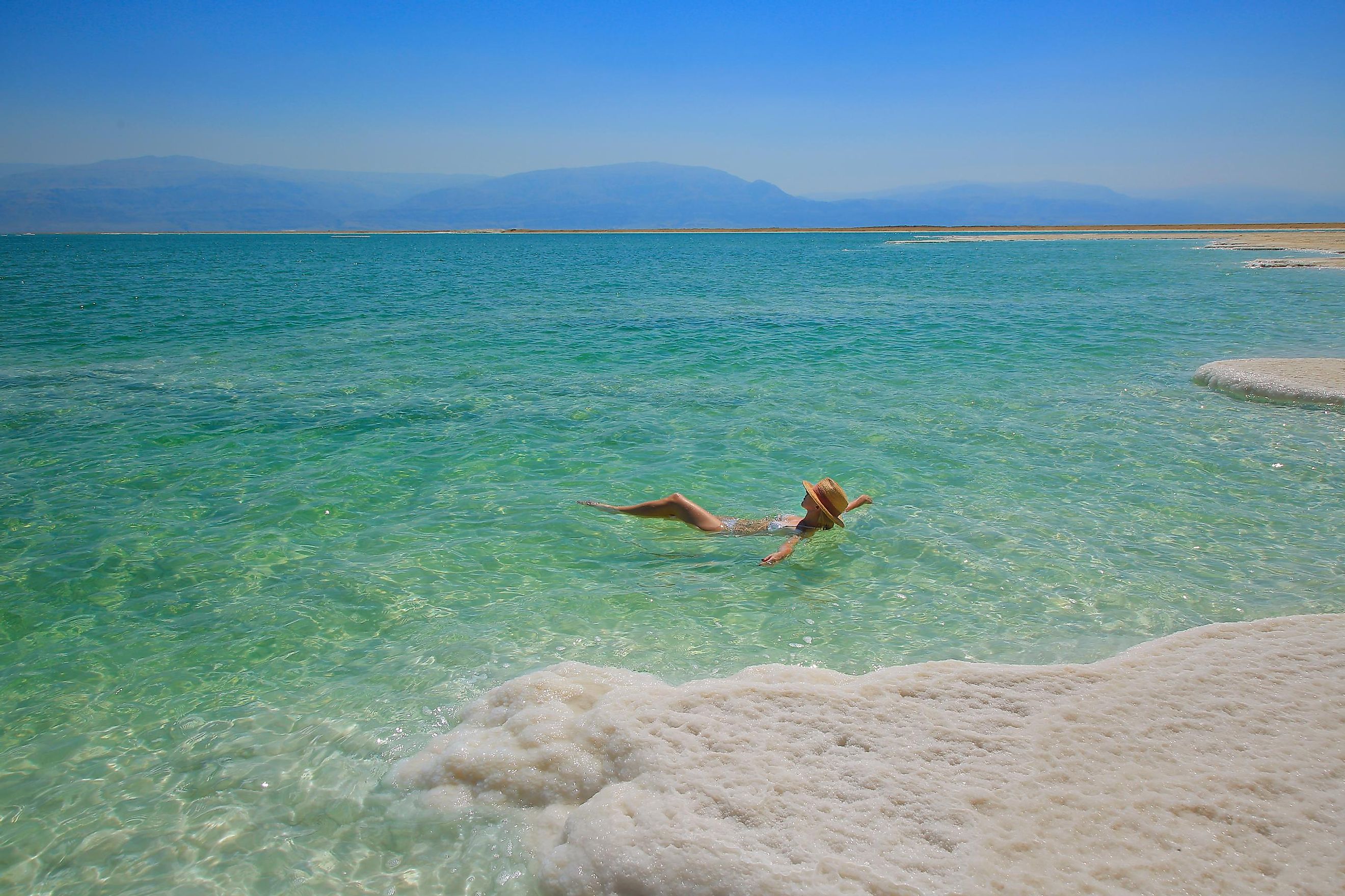 A woman floating in the Dead Sea.