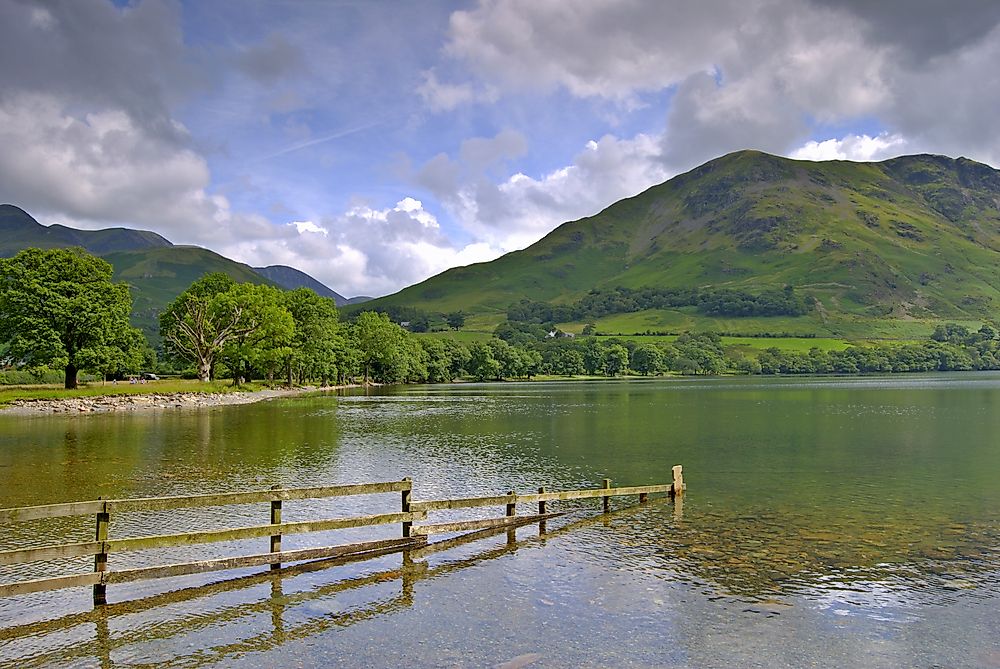A fence is seen partially submerged in the Lake District of England. The island of Great Britain is susceptible to the adverse effects of rising sea levels.