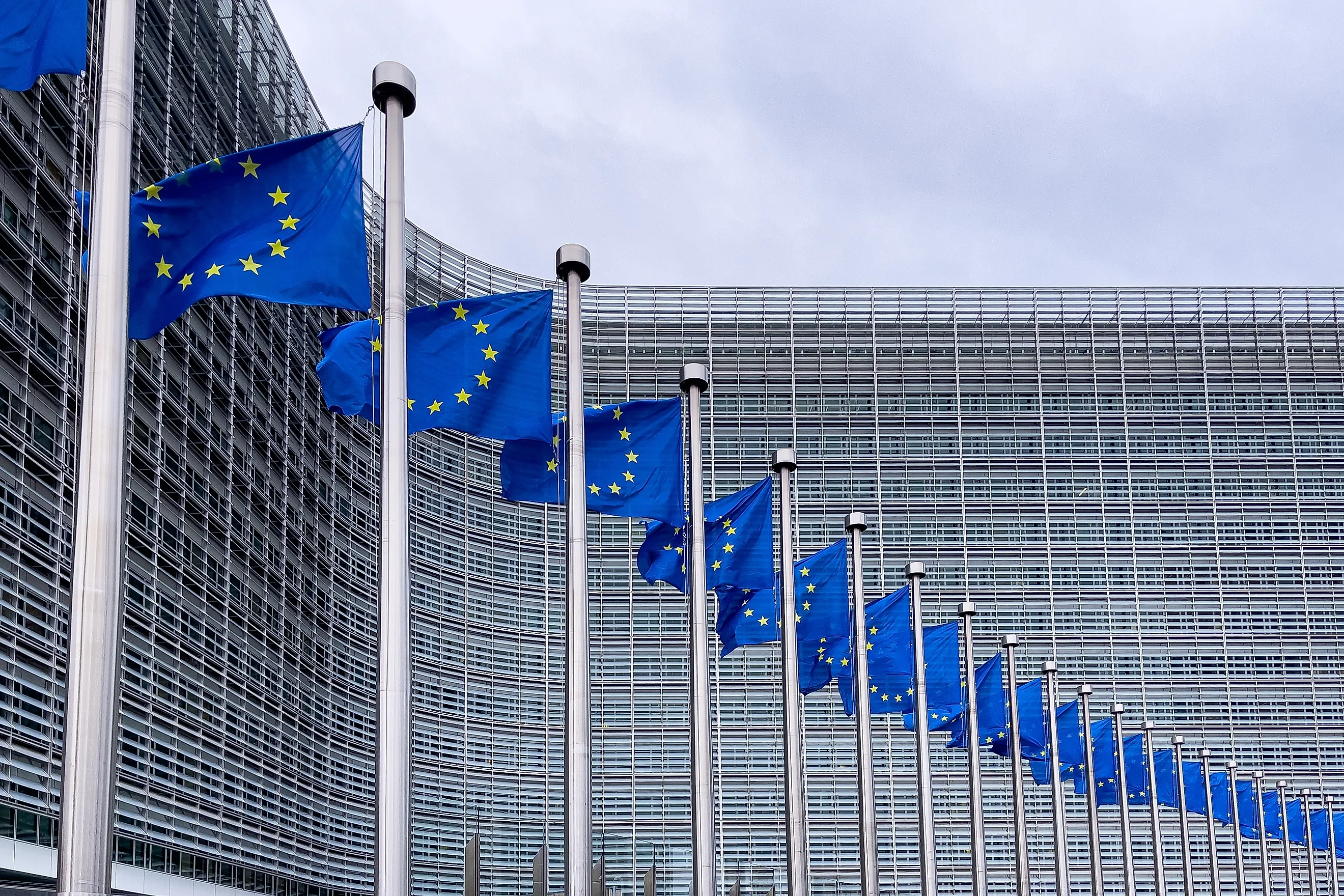 European Union flags in front of the European Commission headquarters in Brussels, Belgium. Editorial credit: Mounir Taha / Shutterstock.com