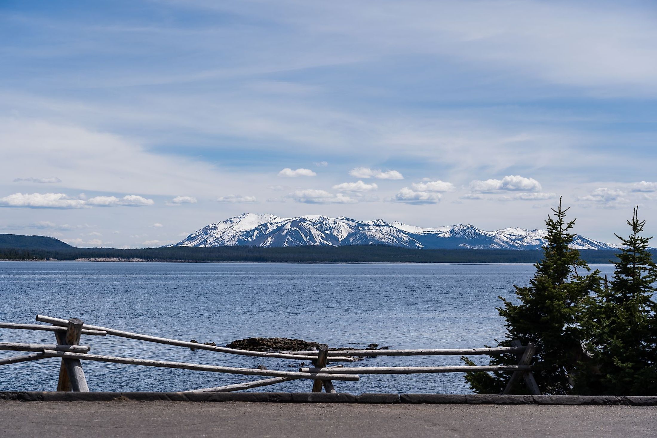 View of Yellowstone Lake with snowcapped mountains in the background. 