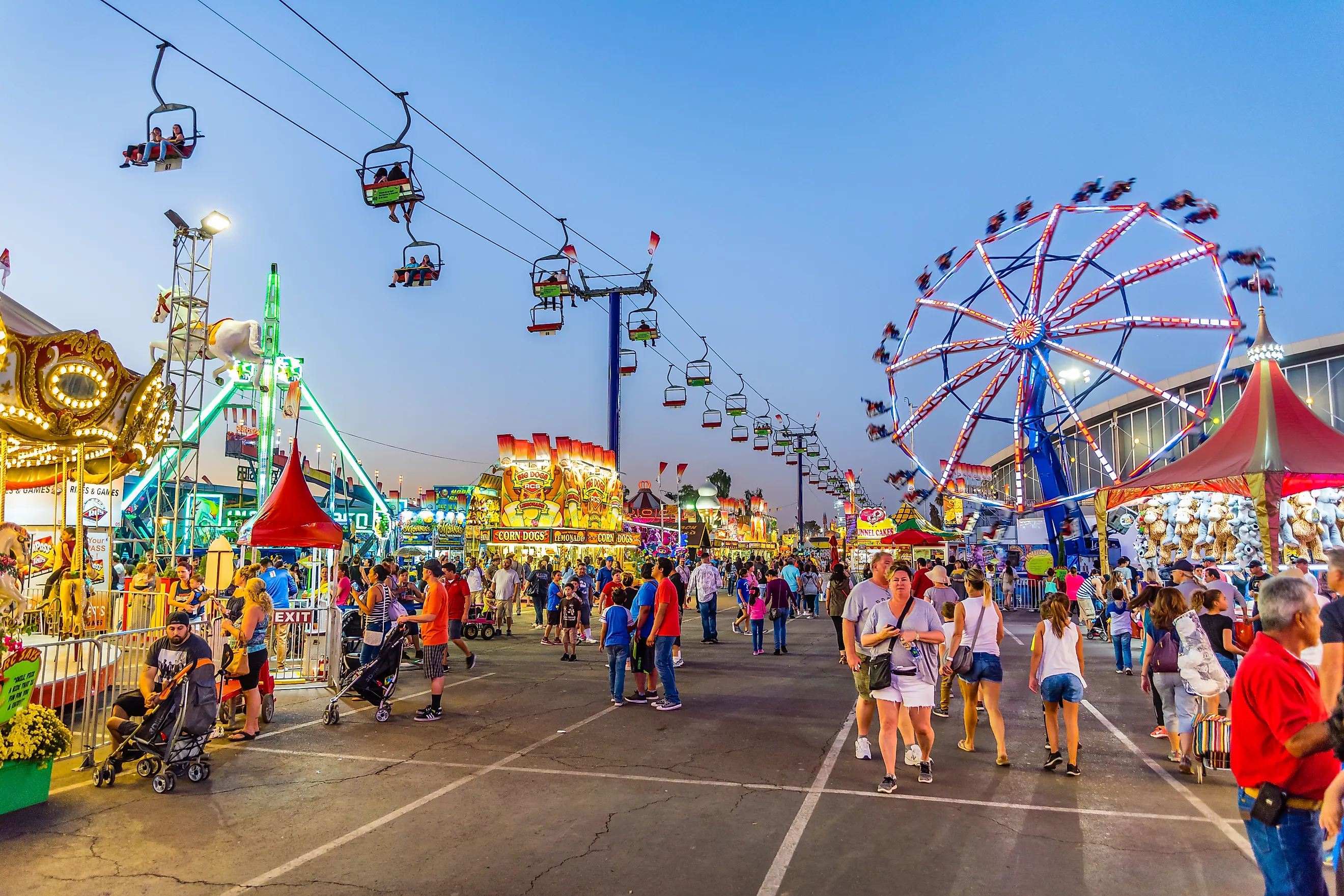 People stroll through the midway at the Arizona State Fair. By Gregory E. Clifford / Shutterstock.com