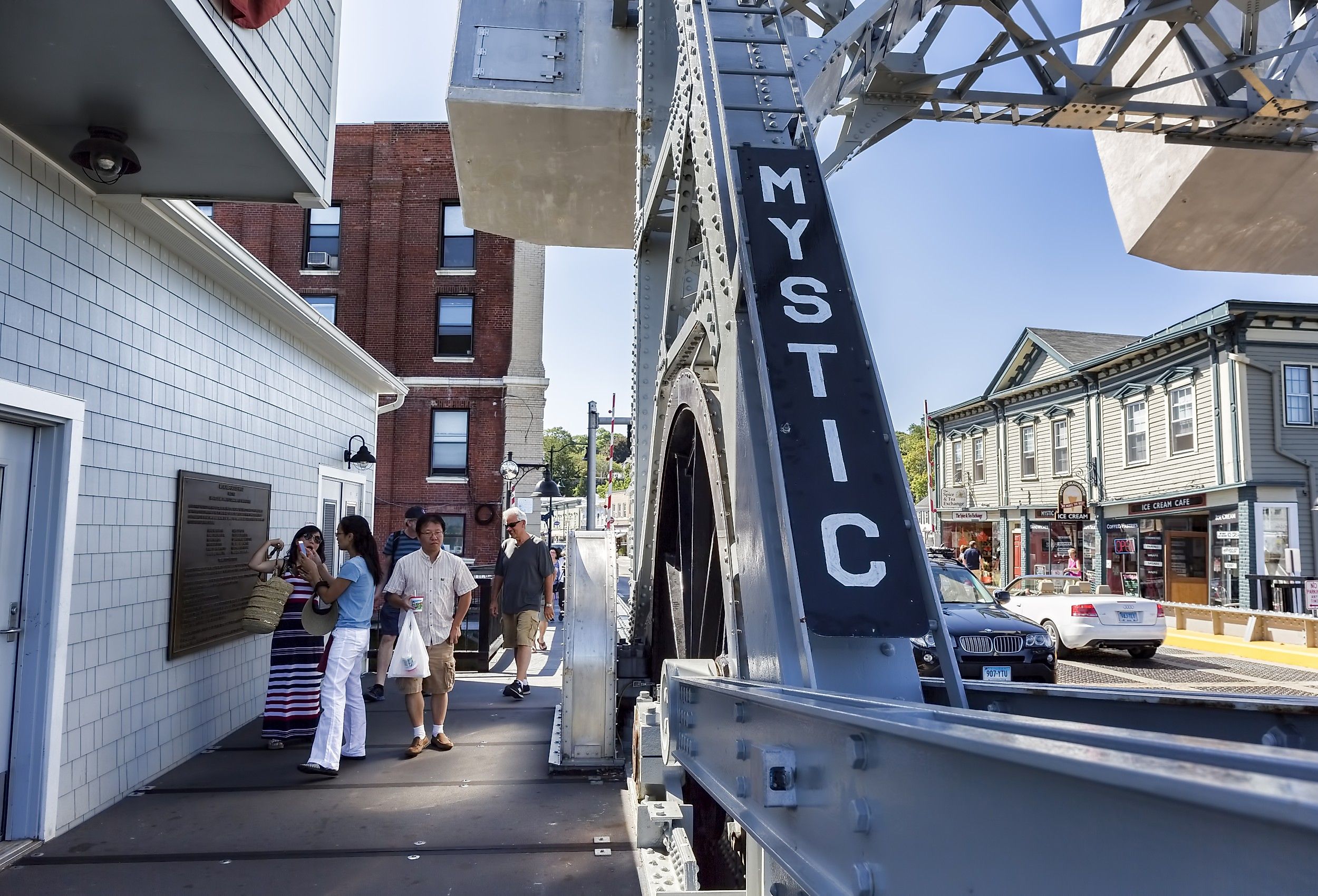 The Mystic Connecticut bridge spans the Mystic River, it carries foot traffic to the tourist district of town. Image credit Paul Latham via Shutterstock