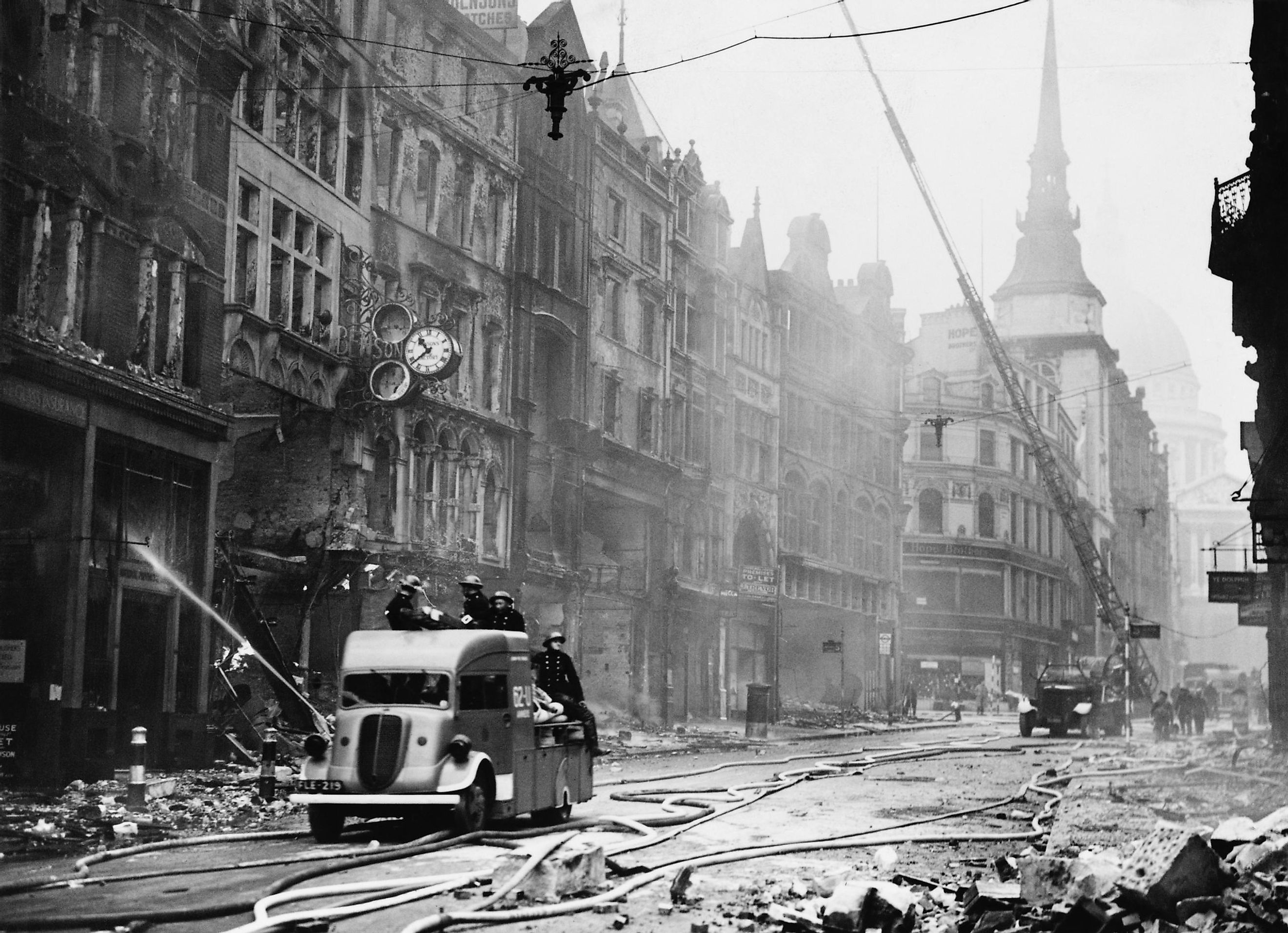 Ludgate Hill area of London with firemen, equipment, and burnt out buildings during the 'Blitz'. Between September 1940 and May 1941, Nazi Germany bombed British cities.