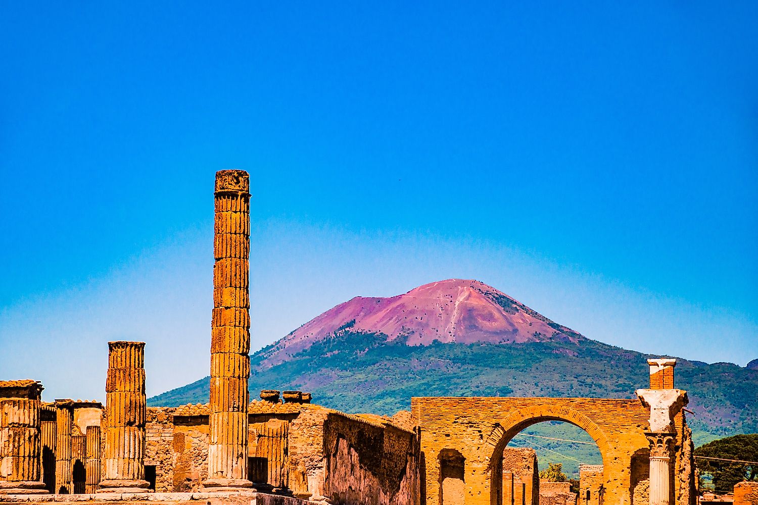 The famous antique site of Pompeii, near Naples. It was completely destroyed by the eruption of Mount Vesuvius (in the background). Image credit: Romas_Photo/Shutterstock.com