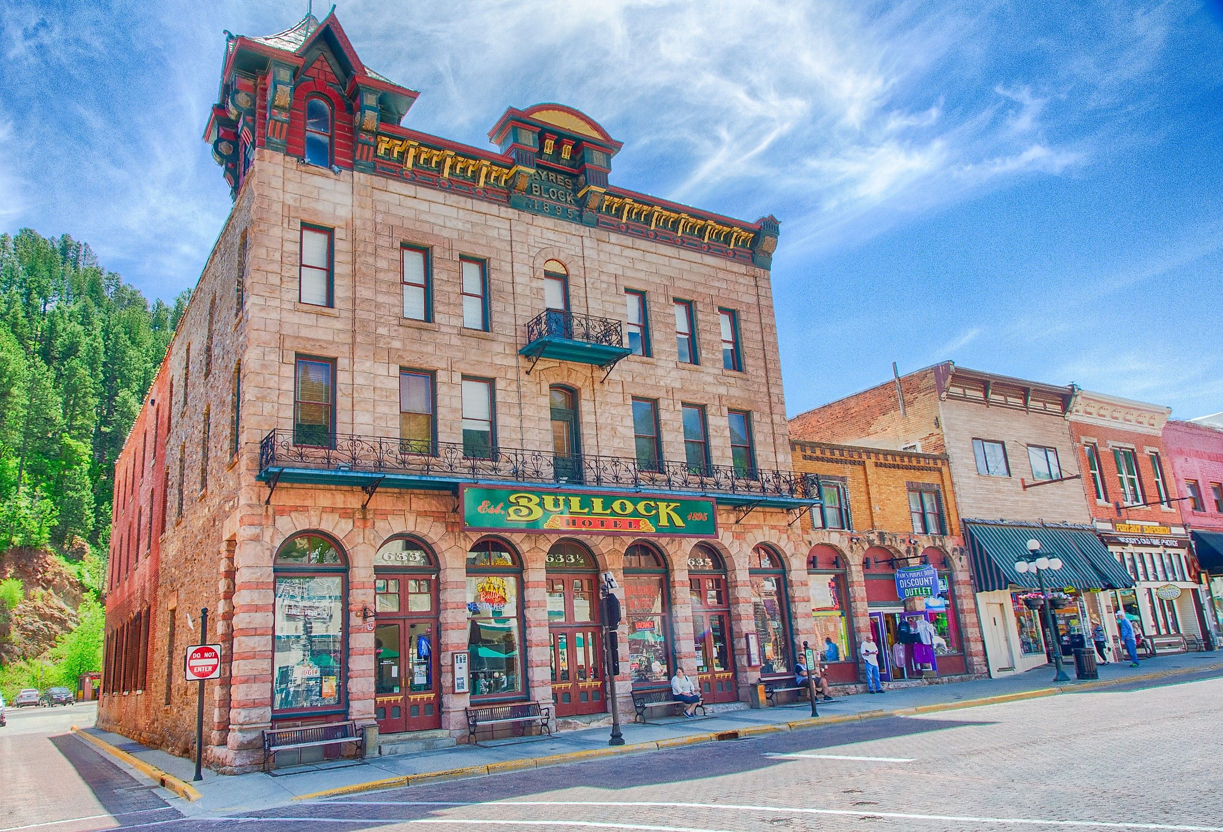 Tourists walk down main street in Deadwood, South Dakota outside the Bullock hotel. Image credit Gary C. Tognoni via Shutterstock