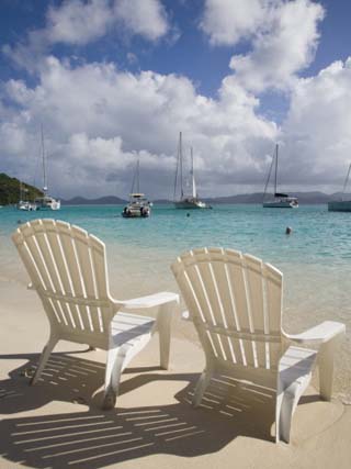 Two Empty Beach Chairs on Sandy Beach on the Island of Jost Van Dyck in the British Virgin Islands
