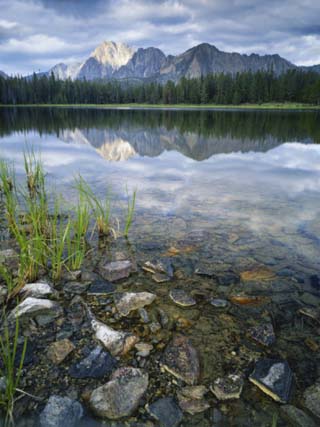 Stones Along Shore of Frog Lake with Mountain Peaks in Back, Sawtooth National Recreation Area, USA