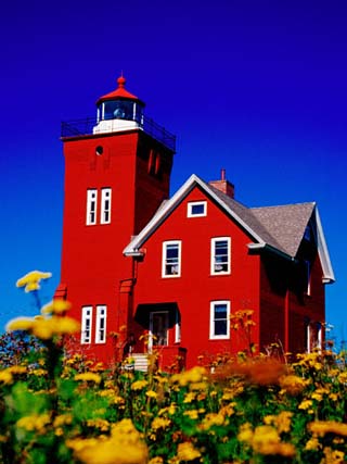 Bright Red Two Harbors Lighthouse with Flowers in Foreground, Lake Superior, Two Harbours, USA