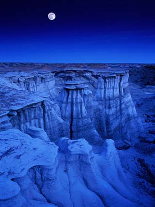 Full Moon Rises Over Landscape in De-Na-Zin Wilderness, Bisti Badlands, New Mexico, USA