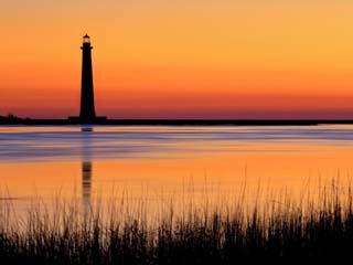Silhouetted Morris Island Lighthouse at Sunrise