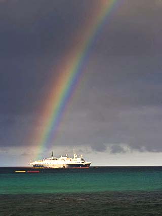 Rainbow Shines over the Lindblad Expeditions Ship in the Galapagos
