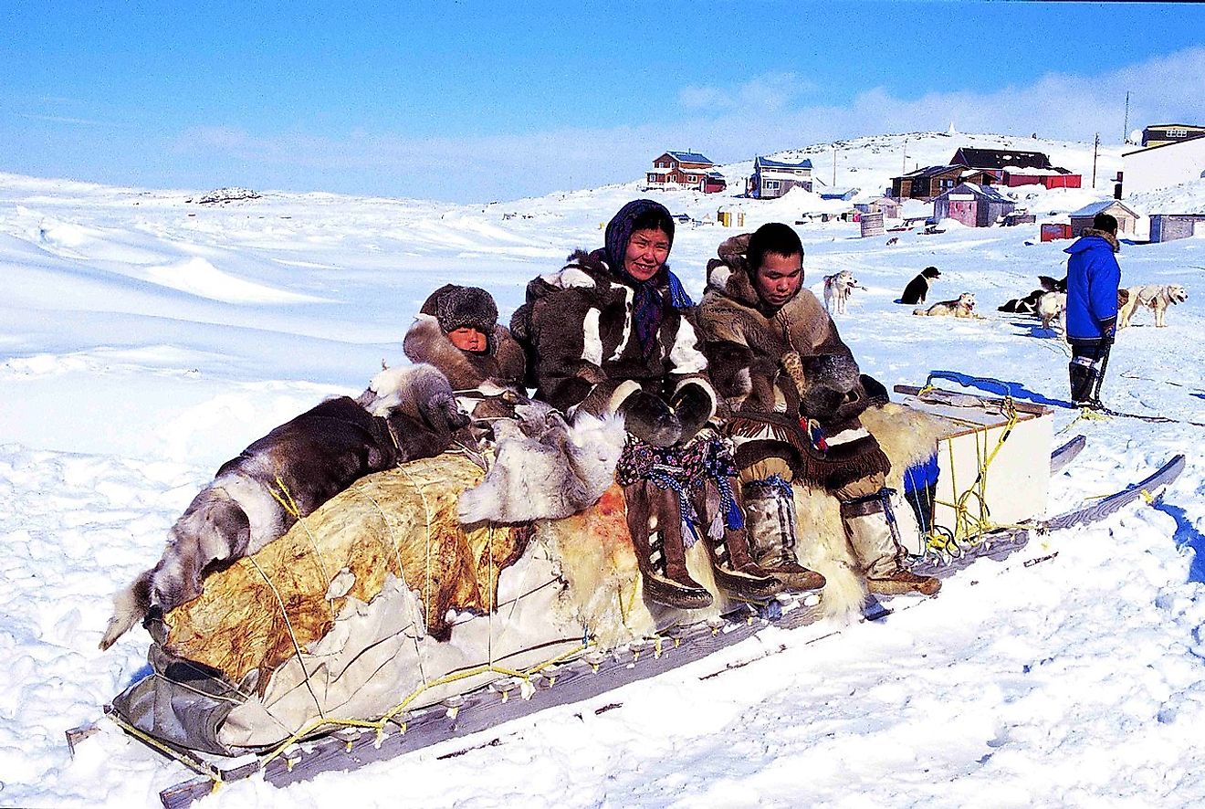 A Innuit family in a their traditional village in Cape Dorset, Nunvavut, Canada. Image credit: Ansgar Walk/Wikimedia.org