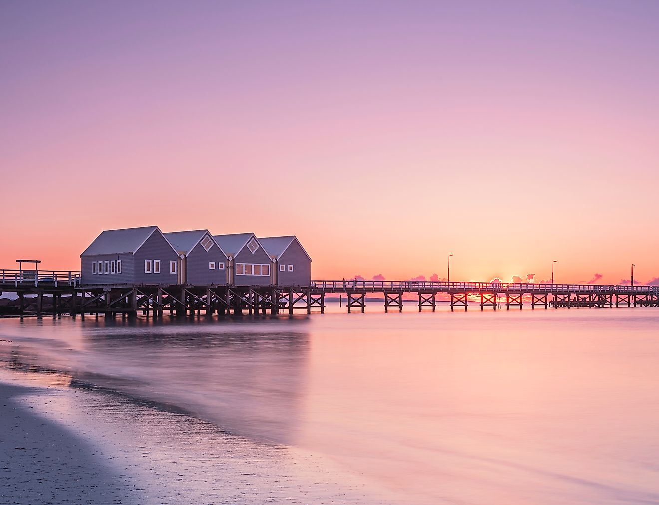 Busselton Jetty stretching into the ocean at sunset in Western Australia