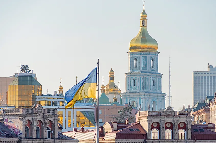 The main symbols of Ukraine - Ukrainian flag and the temple of the Ukrainian Orthodox Church.