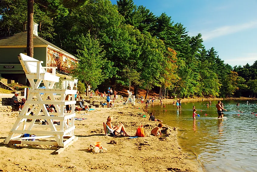 People enjoying a sunny day at the Walden Pond in Concord, Massachusetts.