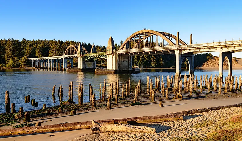 The Siuslaw River bridge in golden morning light at Florence, Oregon.