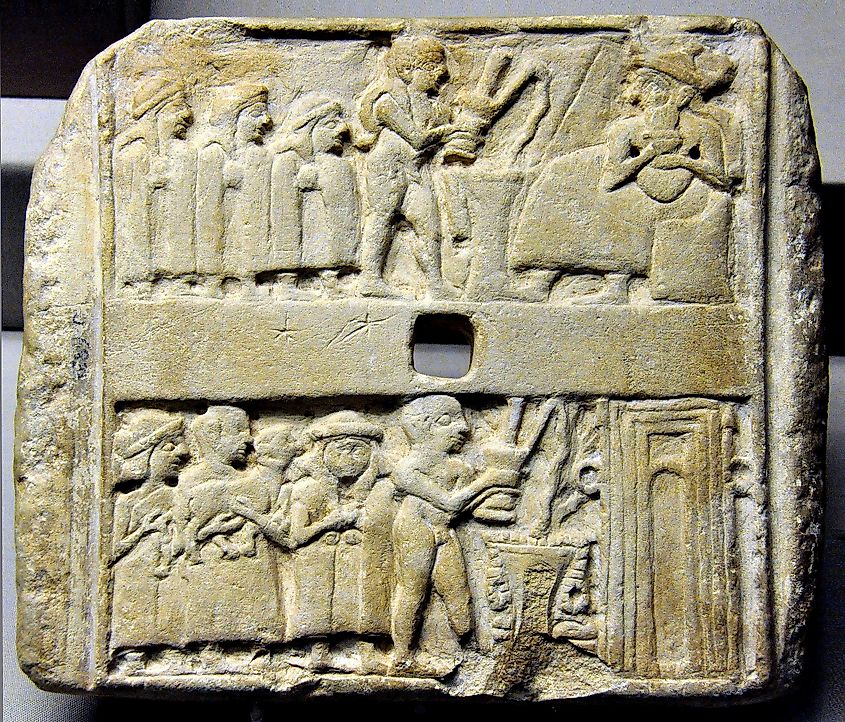 Wall plaque showing libations to a seated god and a temple. Ur, 2500 BC